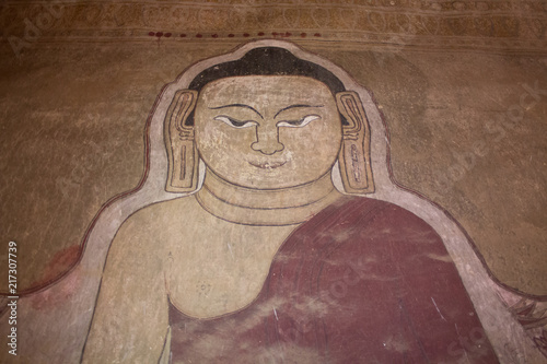 Ruined Buddha painting on the wall