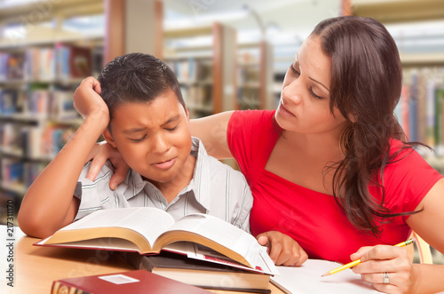 Upset Hispanic Young Boy an...