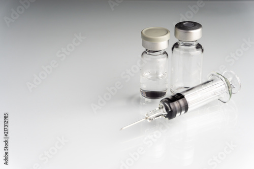 Syringe and vials closeup with selective focus and crop fragment. Medical and Healthcare Concept