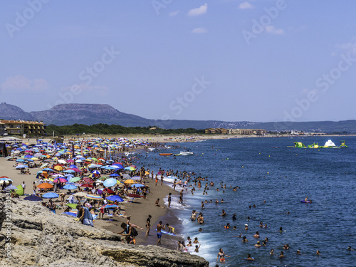 Obraz na płótnie People flock to the beach to avoid summer heat in Pals Beach in Costa Brava Spain w salonie