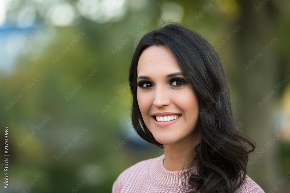 young fashion woman portrait in a park in autumn young fashion woman portrait in a park in autumn