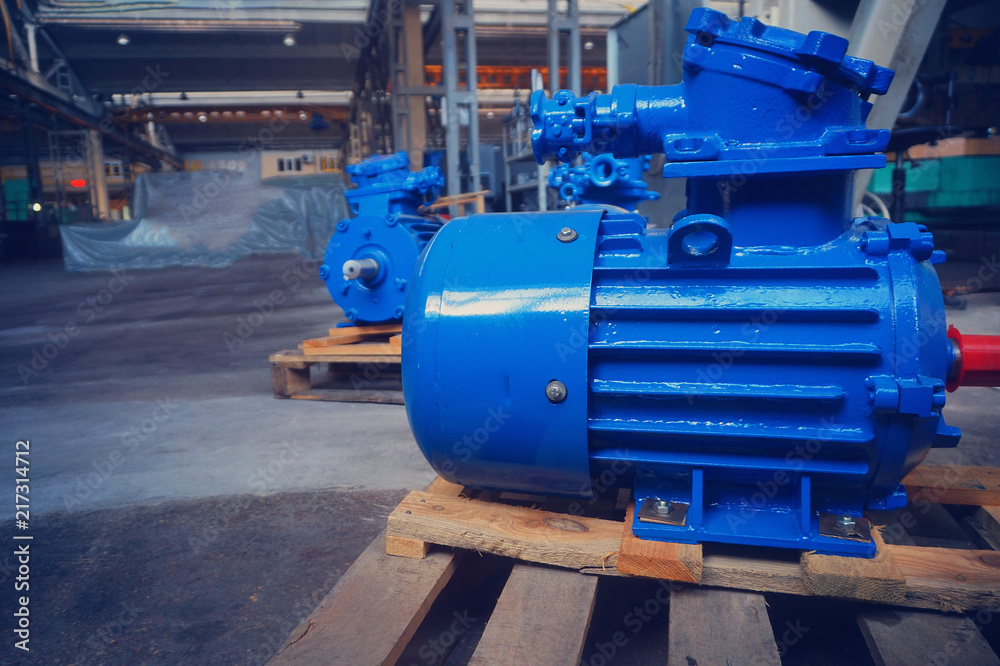 The electric motor is new, blue in stock on the rack The electric motor is new, blue in stock on the rack