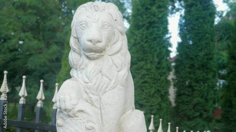 plaster, concrete figurine of a lion on the gate of the residence plaster, concrete figurine of a lion on the gate of the residence