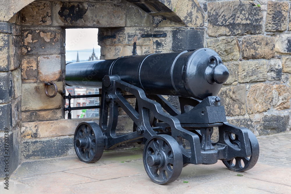 Medieval cannon at loop-hole in Edinburgh Castle, Scotland Medieval cannon at loop-hole in Edinburgh Castle, Scotland