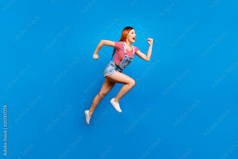 Full-size portrait of running marathon girl who looks in front o