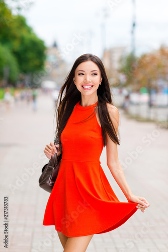 Vertical portrait of beautiful and young Asian woman with leathe