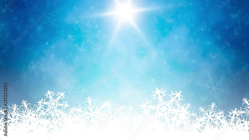 Falling snow on blue sunny background Falling snow on blue sunny background