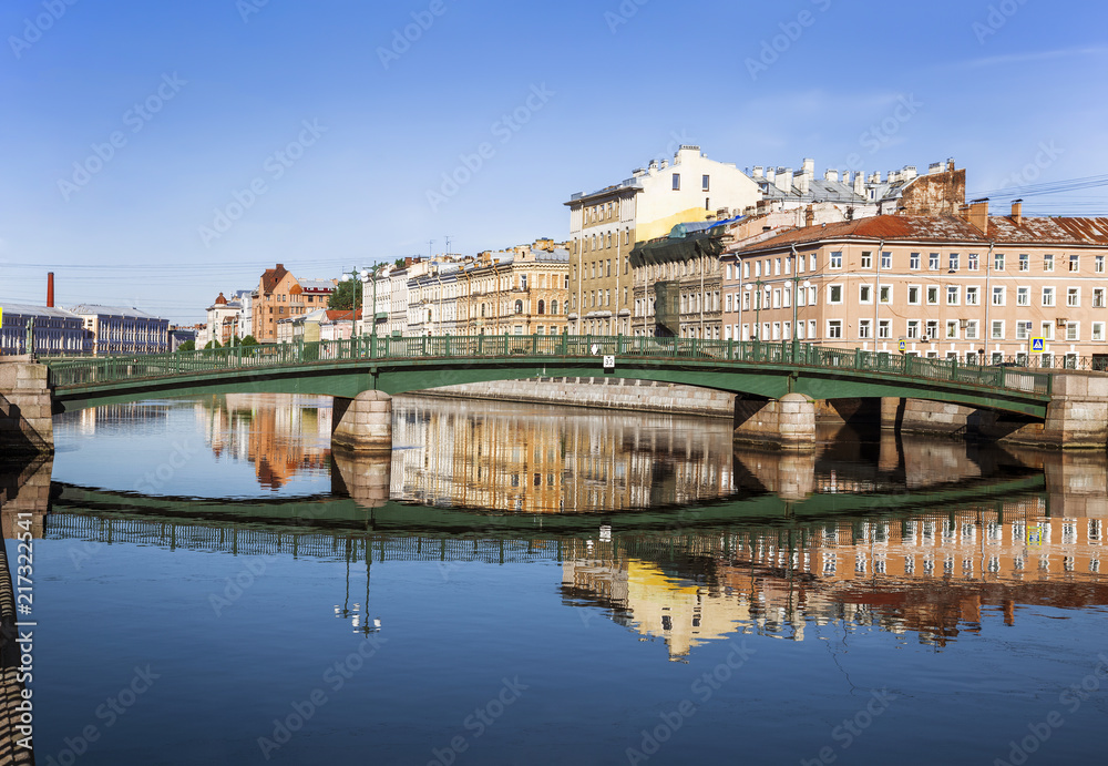 View of the Fontanka river, Krasnoarmeysky bridge and apartment houses on the river embankment, St. Petersburg, Russia
