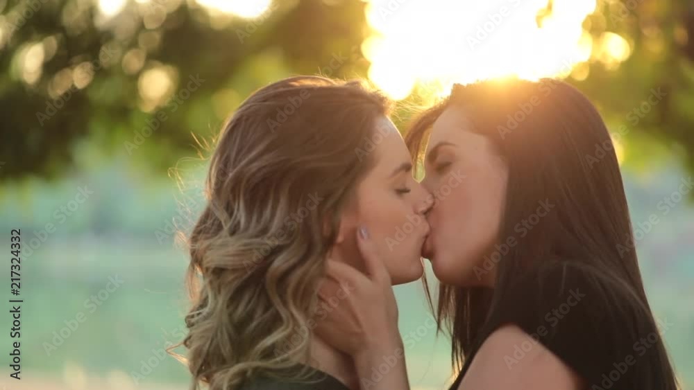 Authentic LGBT female lesbian couple kissing each other in slow-motion. Women kiss each other2 Stock ビデオ | Adobe Stock
