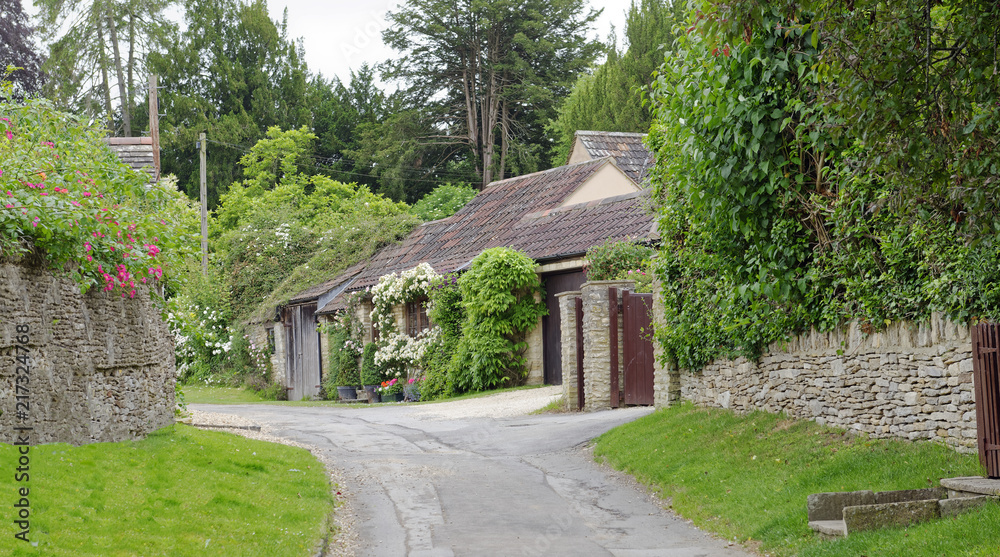 Scenic country lane in the Cotswolds village of Castle Combe in Wiltshire, England