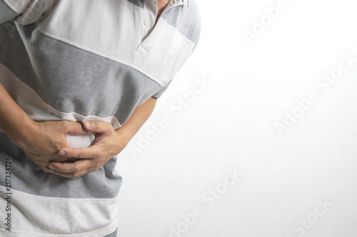 The man is get problem about the stomach and fill sickness for healthy concept on white background.