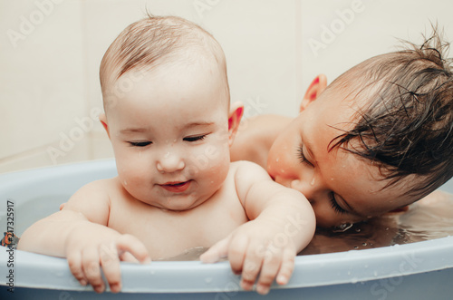 children, brother and sister in the bathroom photo