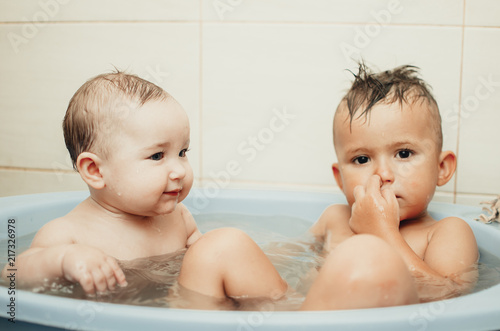 children, brother and sister in the bathroom photo