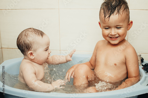 children, brother and sister in the bathroom photo