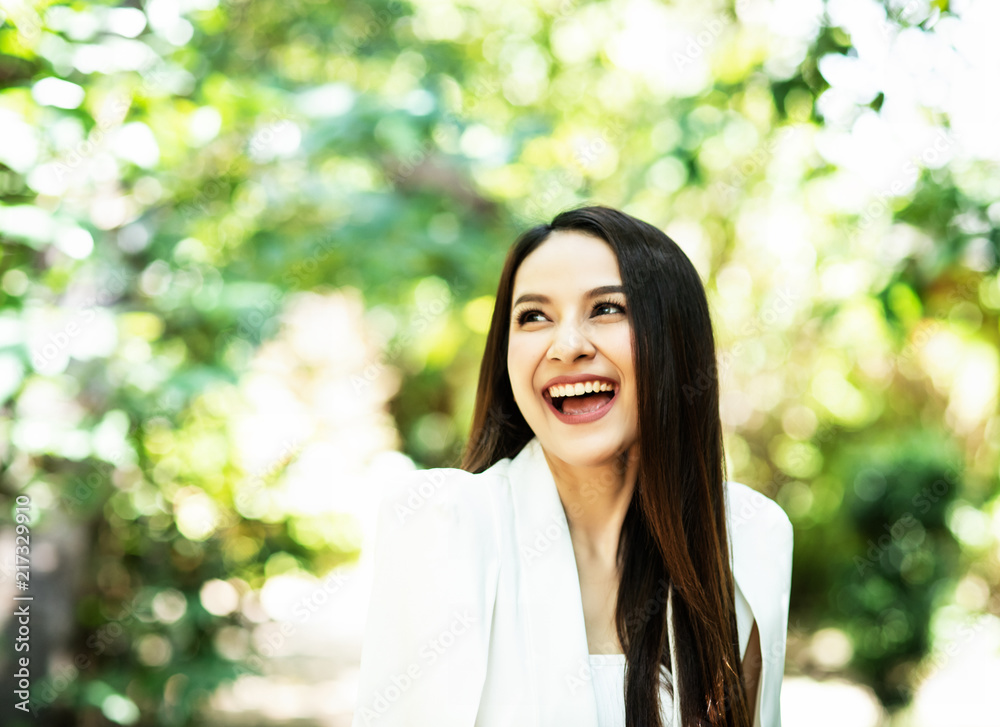 The beauty lady is smiling with happy feeling,blurry light around. The beauty lady is smiling with happy feeling,blurry light around.
