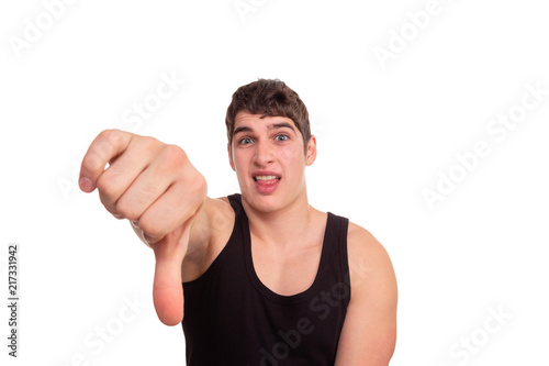  man looks at the camera and shows a gesture of disapproval