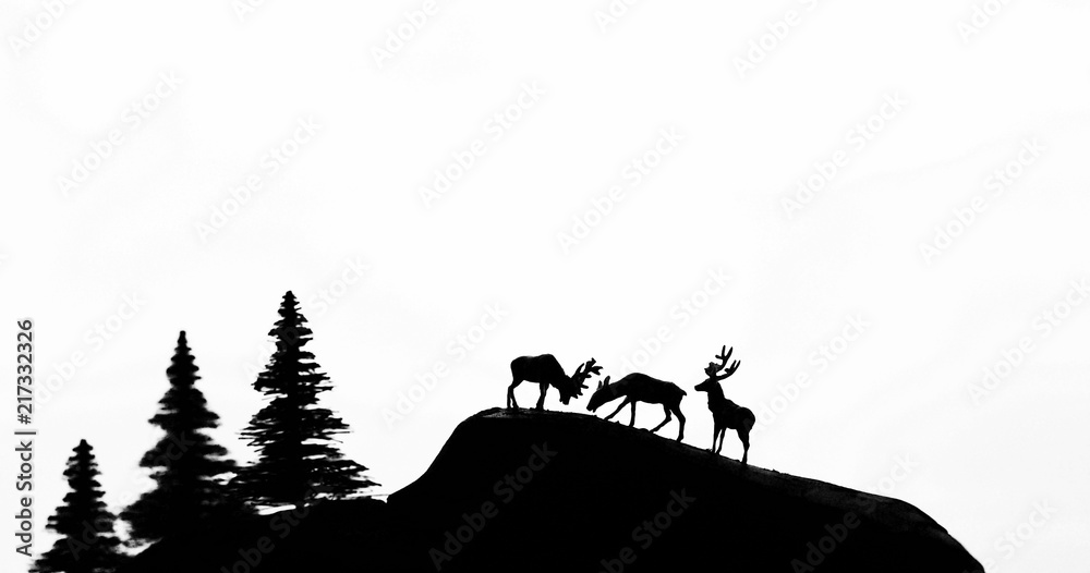 Silhouette deer mountains