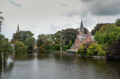 The lake of love "Minnewater" in Bruges at cold, cloudy day © vadiml