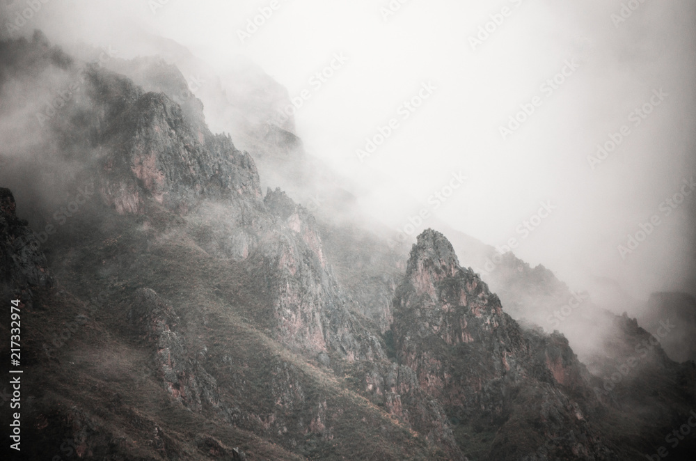 Fototapeta premium High mountains and rocks in the clouds
