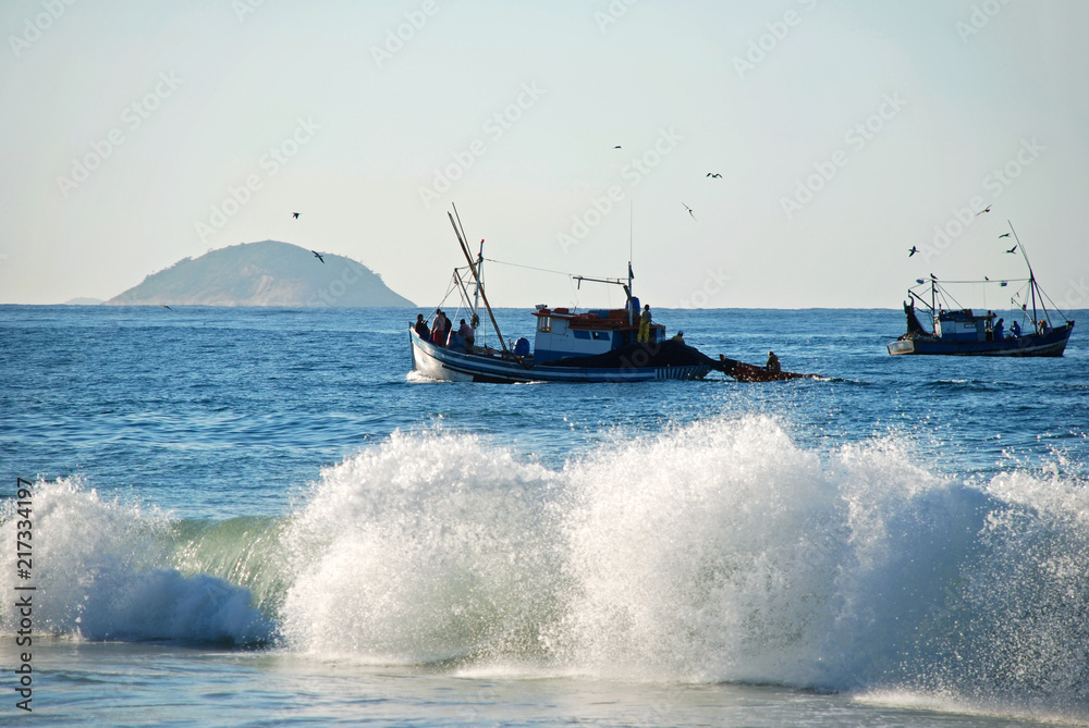 Naklejka premium Fishing boat on Copacabana beach Rio de Janeiro