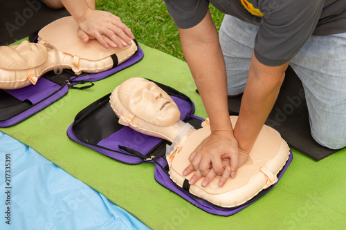 CPR trainning to a patient sudden cardiac arrest with Patient model. Selective focus.