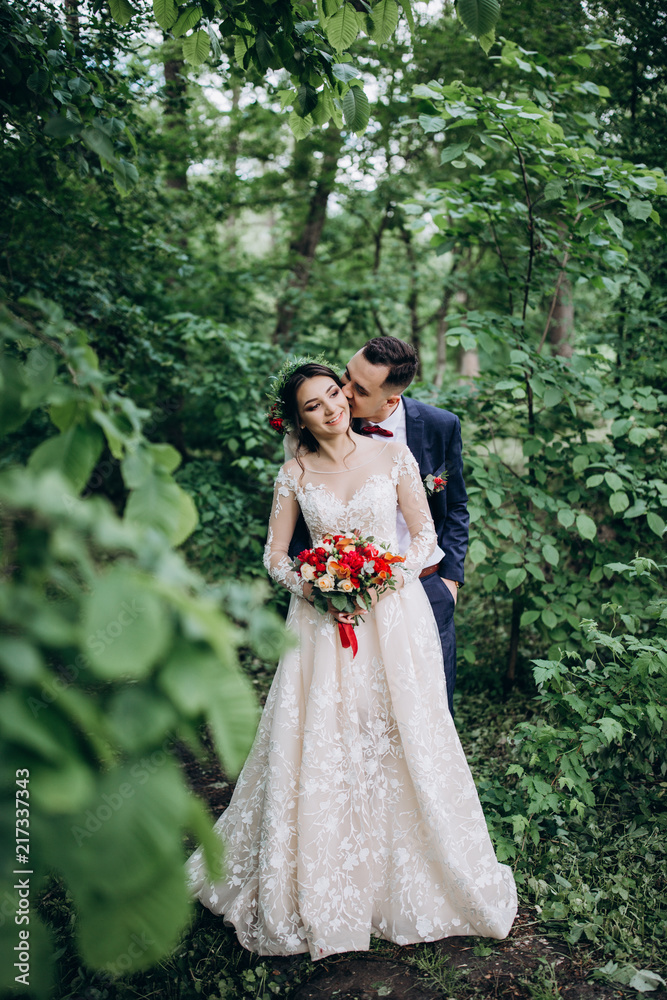 Walking newlyweds in nature. Walking newlyweds in nature.
