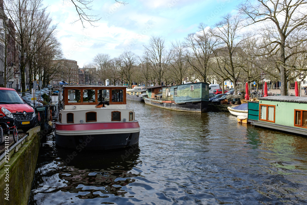 Traditional old buildings and and boats in Amsterdam, . Canals of Amsterdam