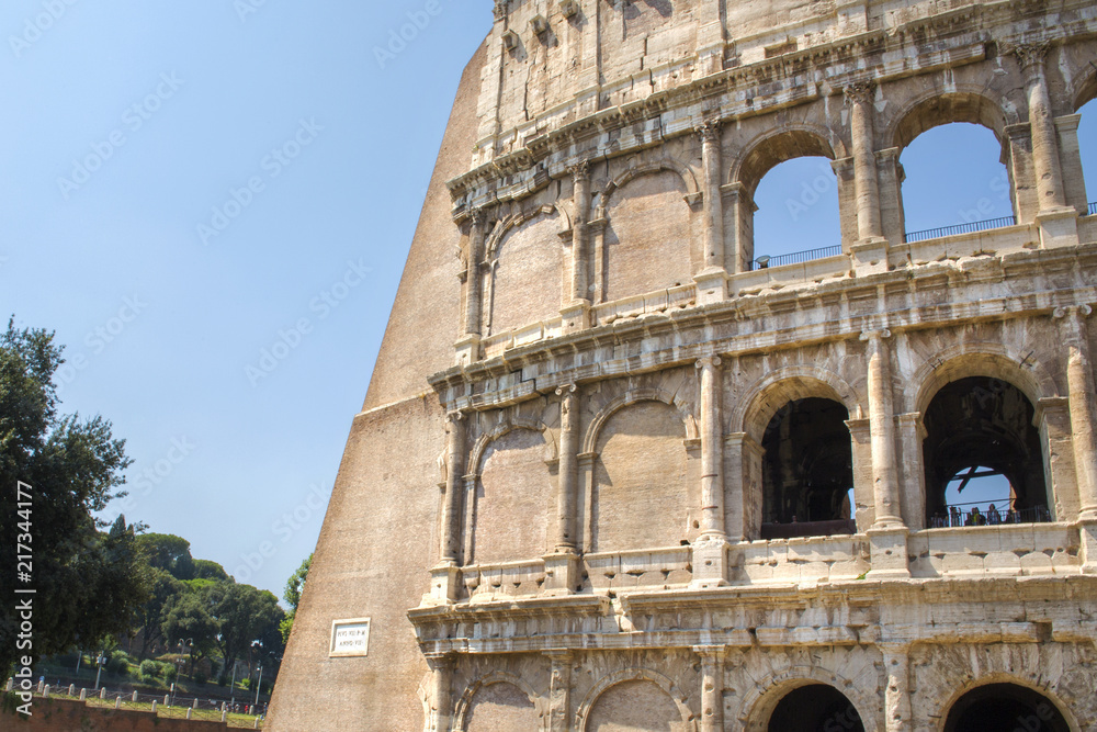 Obraz premium Detail of the Colosseum, known as Amphitheatrum Flavium, symbol of the city of Rome, of Italy and one of the seven wonders of the world. In ancient times it was used for gladiatorial shows.