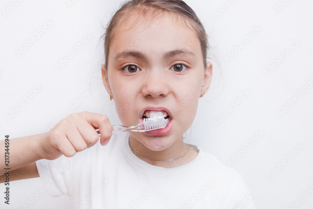 Girl brushing cleaning teeth. Girl with toothbrush. Oral hygiene, isolated Girl brushing cleaning teeth. Girl with toothbrush. Oral hygiene, isolated