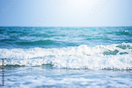 Fototapeta Naklejka Na Ścianę i Meble -  Soft wave of blue ocean on sandy beach background,ocean waves,storm,beautiful background,close-up