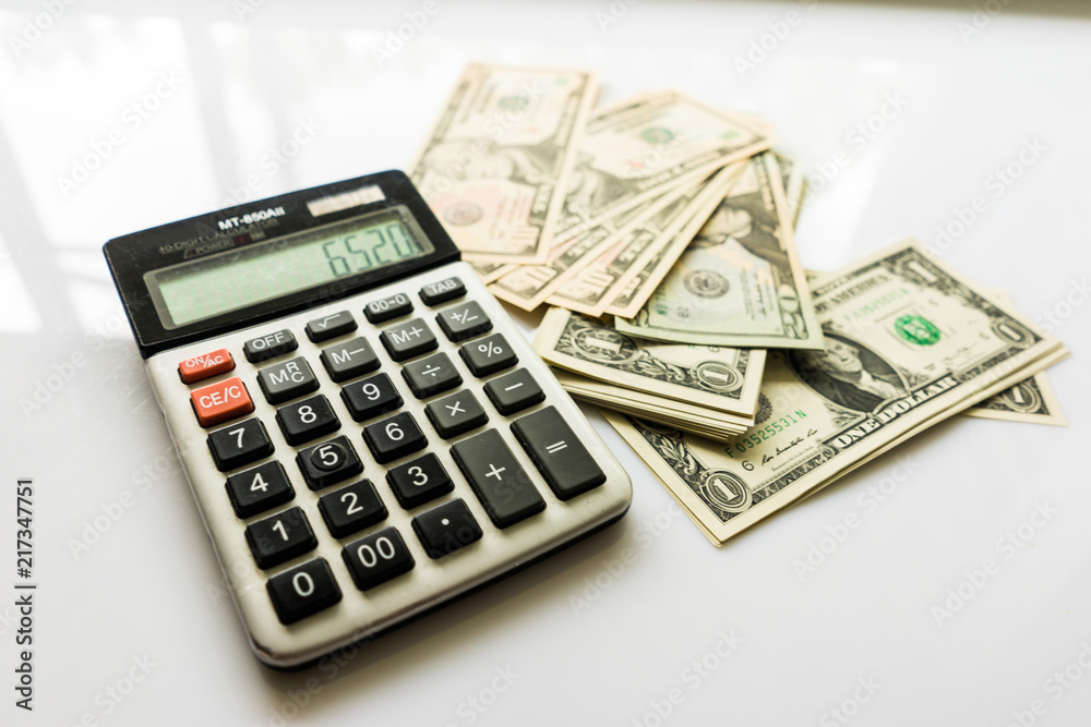 Close-up Money and Calculator, American Dollar Banknotes Close-up Money and Calculator, American Dollar Banknotes