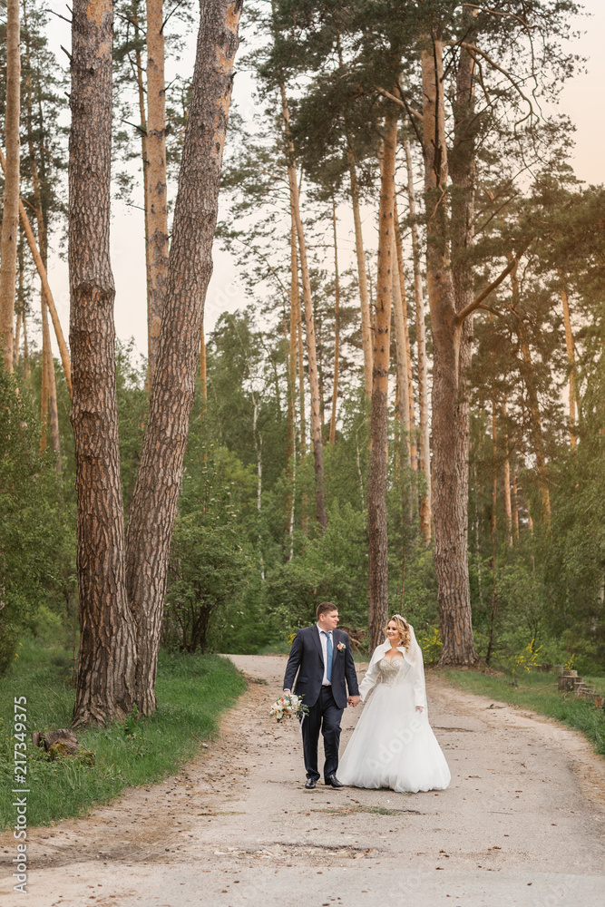Wedding day. Newlyweds in the forest. Just married Wedding day. Newlyweds in the forest. Just married