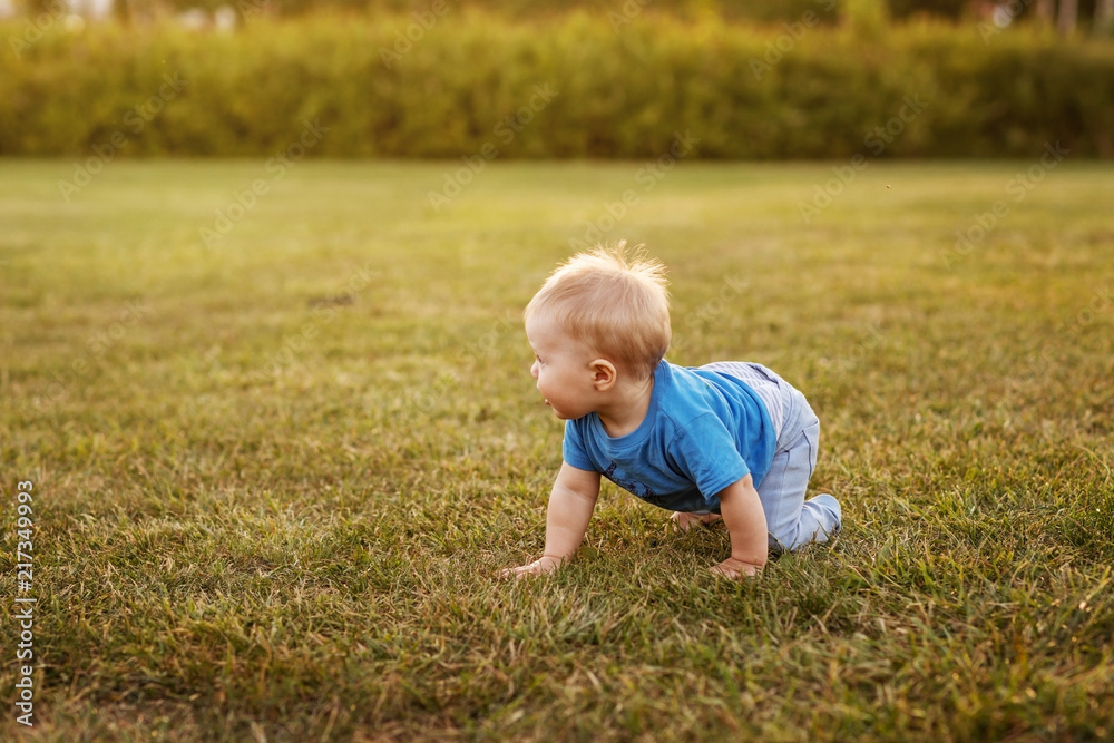 Baby first year life fun crawling on the grass. Baby first year life fun crawling on the grass.