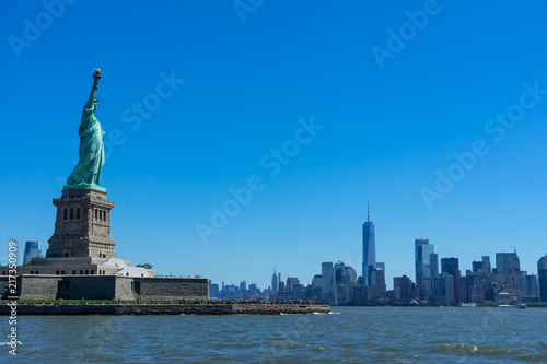 Statue of Liberty Looking Upon Skyline © Brian
