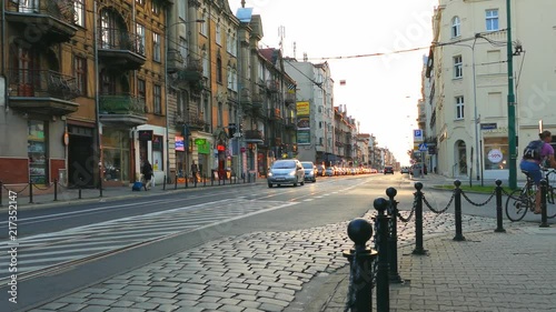 Wallpaper Mural City at sunset. The man on the bike passes through the intersection turning into the street on the right. Torontodigital.ca