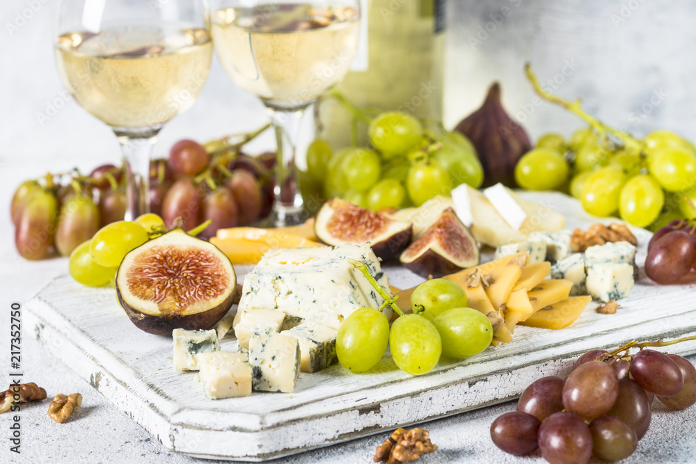 Cheese plate with grapes, figs and nuts. Cheese plate with grapes, figs and nuts.