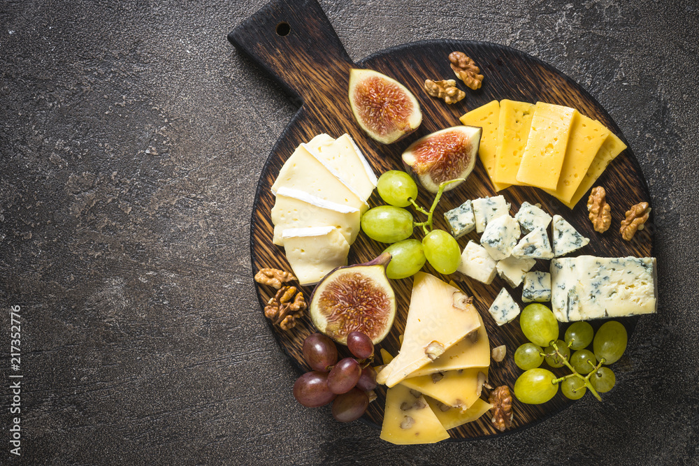 Cheese plate with grapes, figs and nuts. Cheese plate with grapes, figs and nuts.