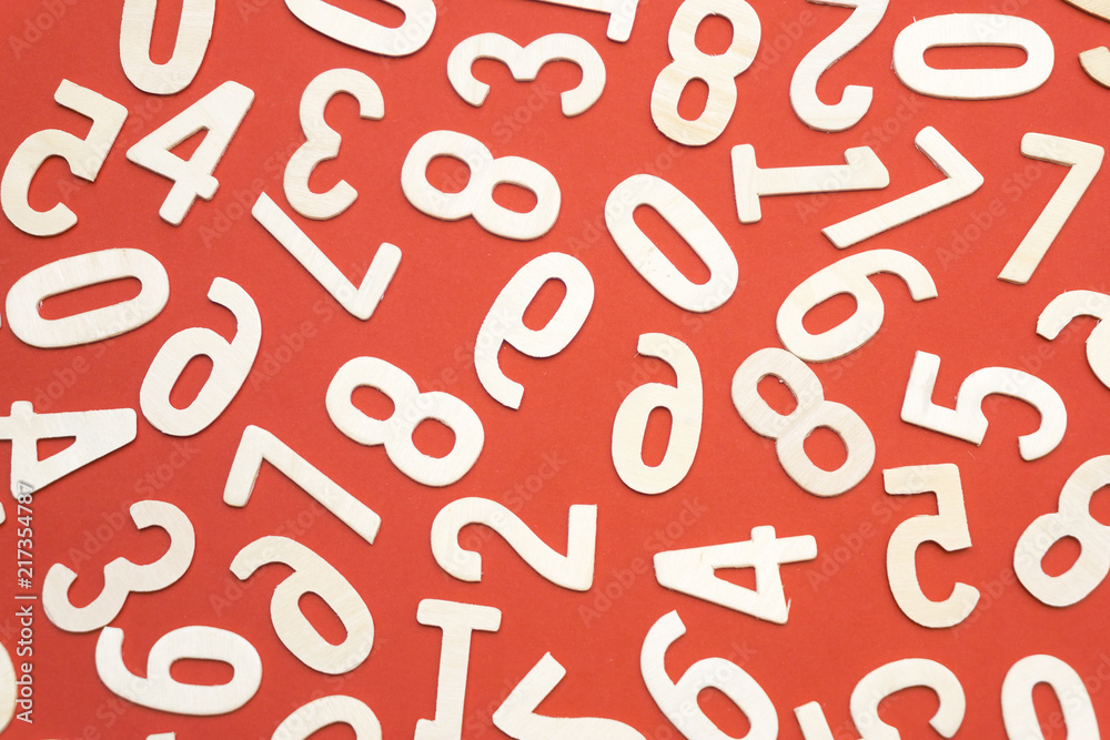 wooden numbers on red paper wooden numbers on red paper