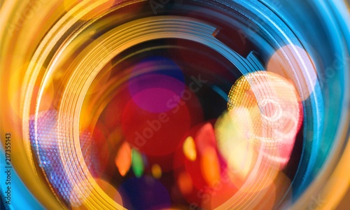 Camera lens with lens reflections on background.