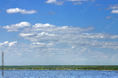 beautiful summer landscape with white clouds in the blue sky