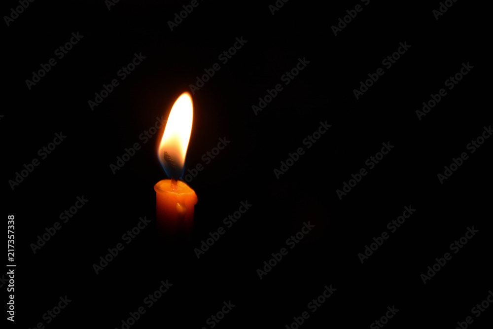 Fire light from candle isolated on black background