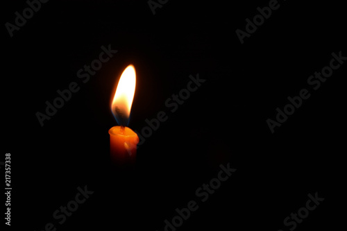 Fire light from candle isolated on black background