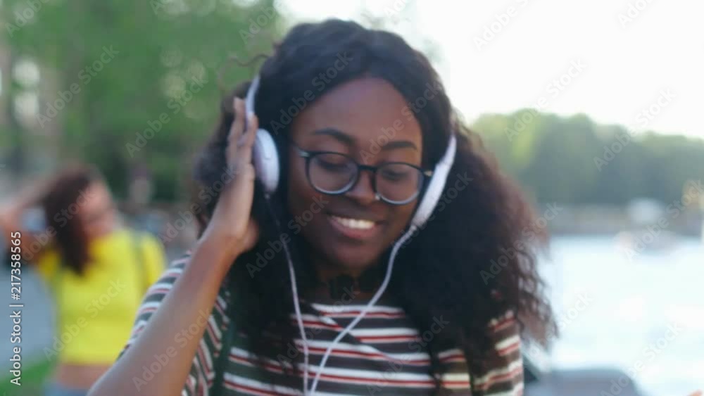 Young beautiful african girl walking the street Young beautiful african girl walking the street