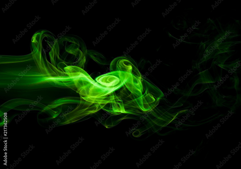 Green smoke on black background Green smoke on black background