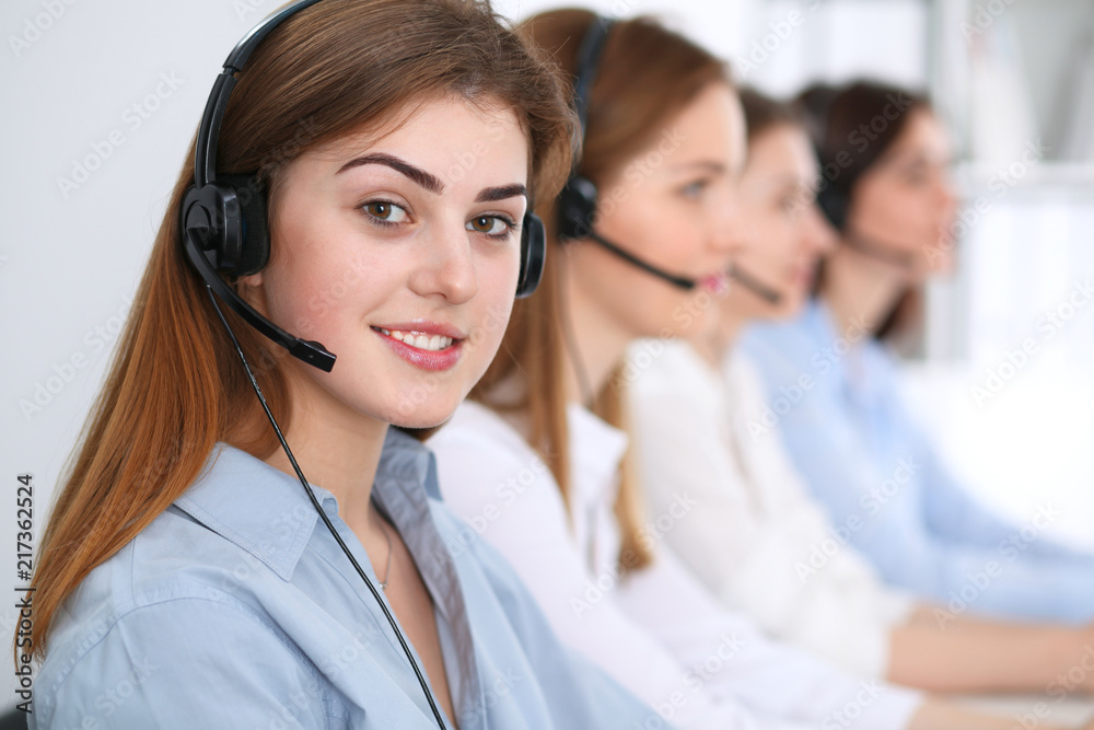 Call center. Beautiful cheerful smiling operator consulting clients with headset. Business concept of customer service Call center. Beautiful cheerful smiling operator consulting clients with headset. Business concept of customer service