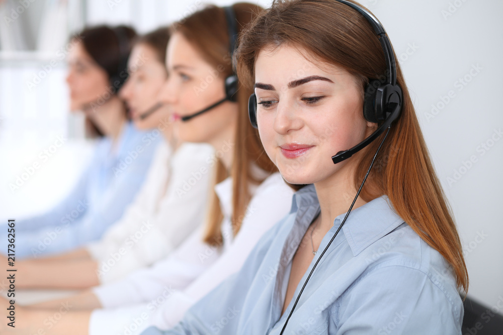 Call center. Beautiful cheerful smiling operator consulting clients with headset. Business concept of customer service Call center. Beautiful cheerful smiling operator consulting clients with headset. Business concept of customer service