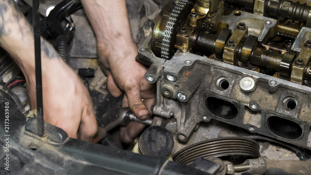 Mechanic repairs the car engine