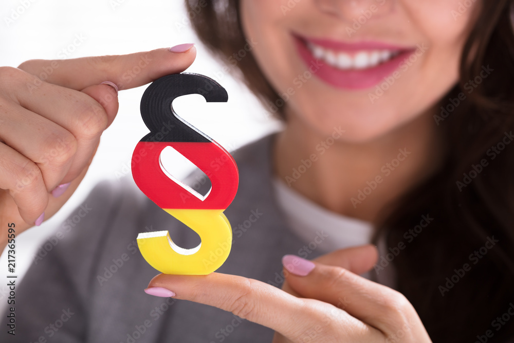 Close-up Of A Woman Holding Paragraph Symbol