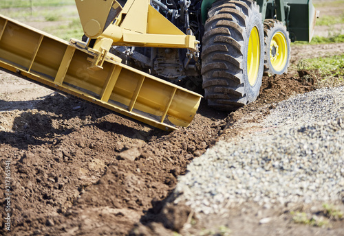 Grader making a drainage ditch photo