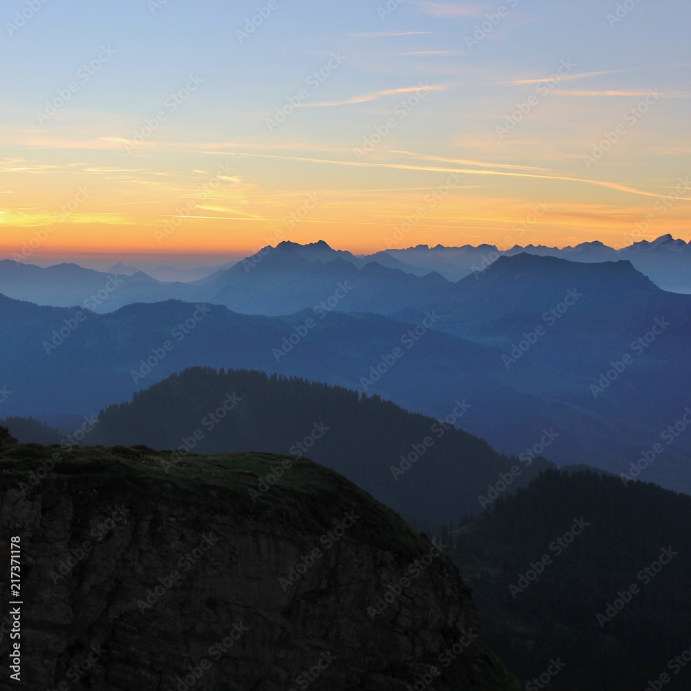 Early morning in the Swiss Alps. Mountain ranges at sunrise, View from Mount Niederhorn. Switzerland.